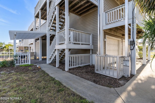 view of home's exterior with a garage and stairs