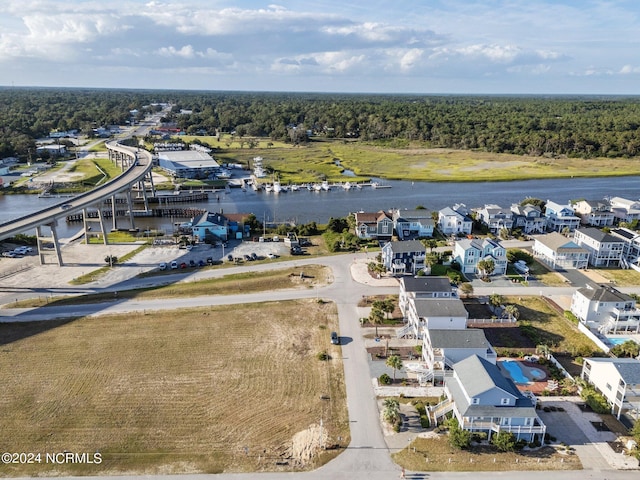 bird's eye view featuring a water view and a view of trees