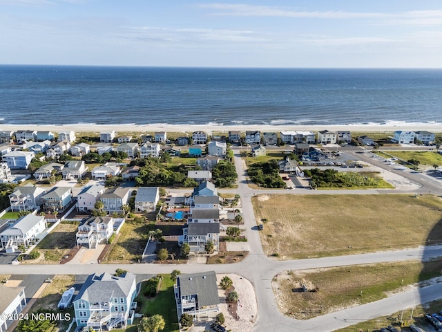 birds eye view of property featuring a water view and a residential view