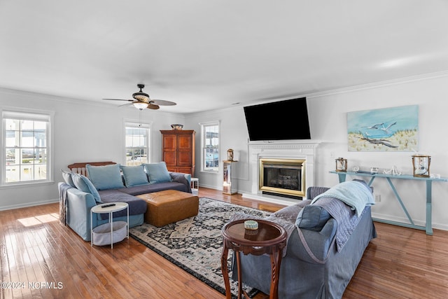 living room featuring hardwood / wood-style flooring and ornamental molding