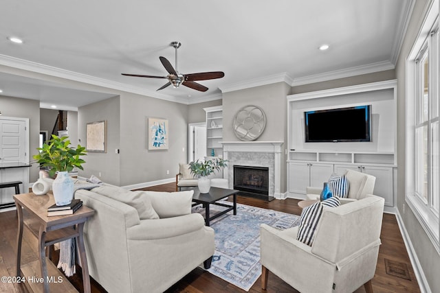 living area featuring a fireplace, visible vents, dark wood finished floors, and ornamental molding