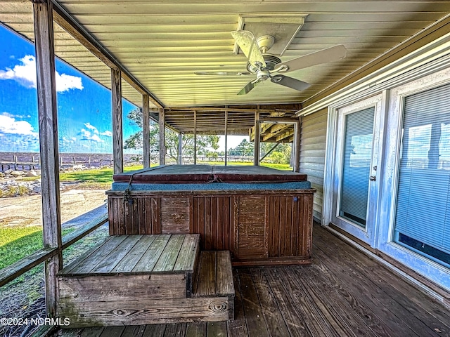 unfurnished sunroom with ceiling fan and wood ceiling