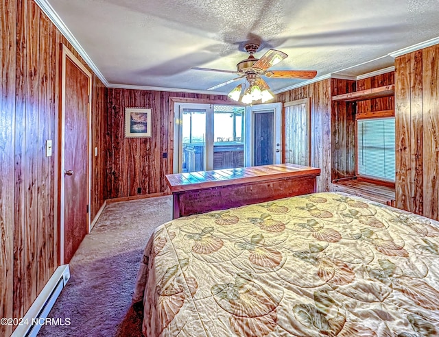 unfurnished bedroom featuring ornamental molding, baseboard heating, a textured ceiling, carpet flooring, and wood walls