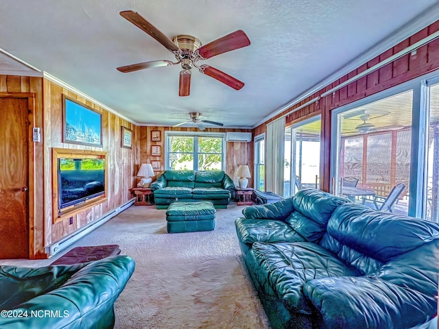 interior space featuring a textured ceiling, wood walls, ornamental molding, baseboard heating, and a wall mounted AC