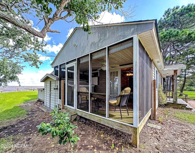 view of outdoor structure featuring a sunroom