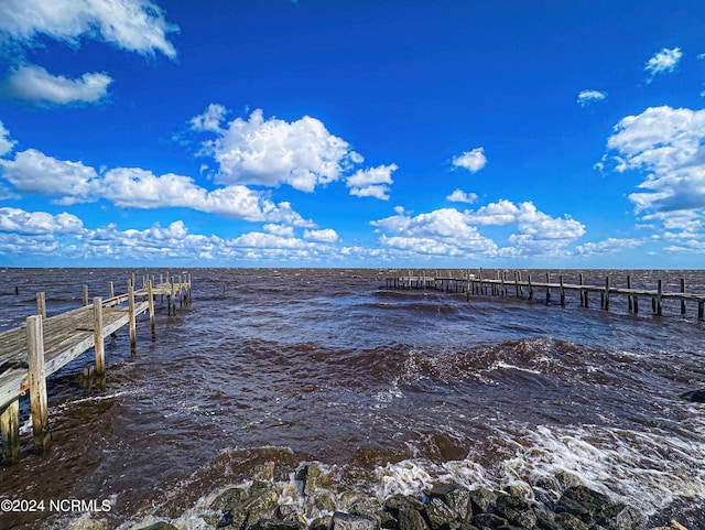 dock area featuring a water view