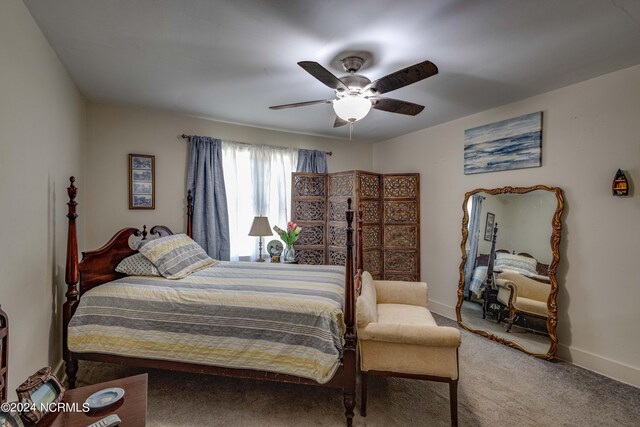 bedroom featuring ceiling fan and carpet