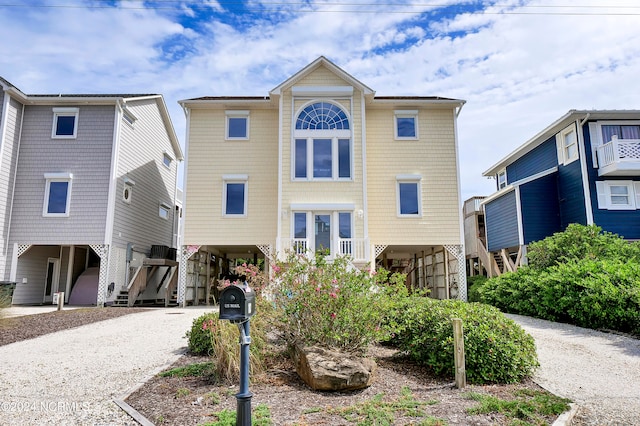 view of front of property featuring a carport