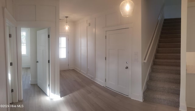 foyer with stairway and wood finished floors