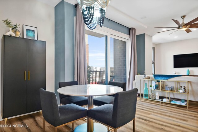 dining area featuring ceiling fan and wood finished floors