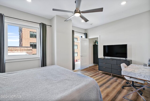 bedroom featuring recessed lighting, wood finished floors, and ceiling fan