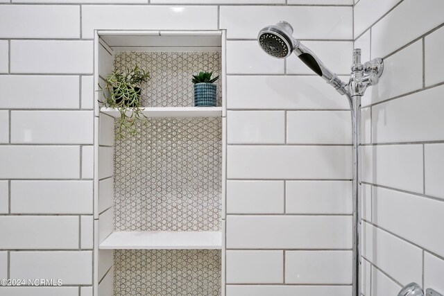 room details with a tile shower