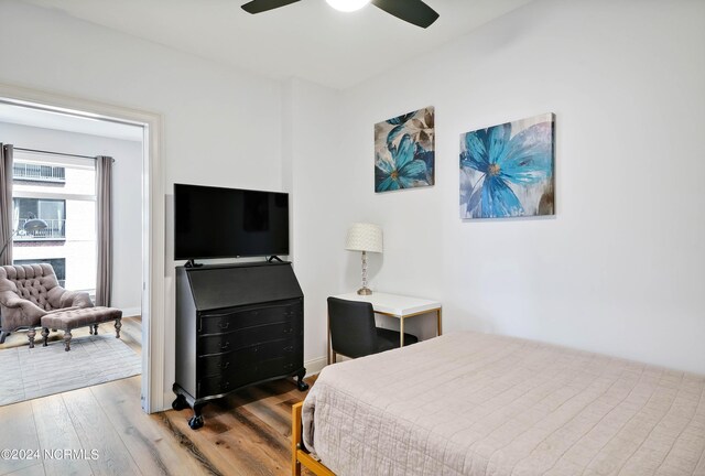 bedroom with ceiling fan and wood finished floors