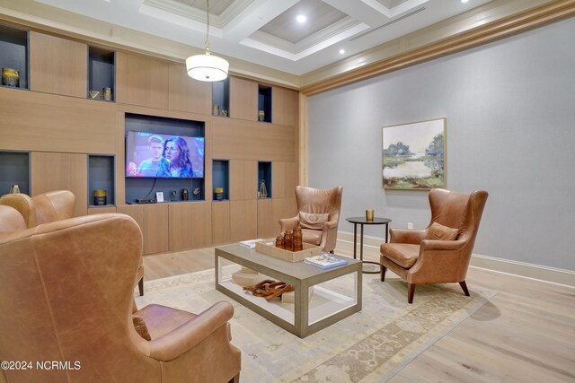 living room featuring crown molding, beamed ceiling, wood finished floors, and coffered ceiling