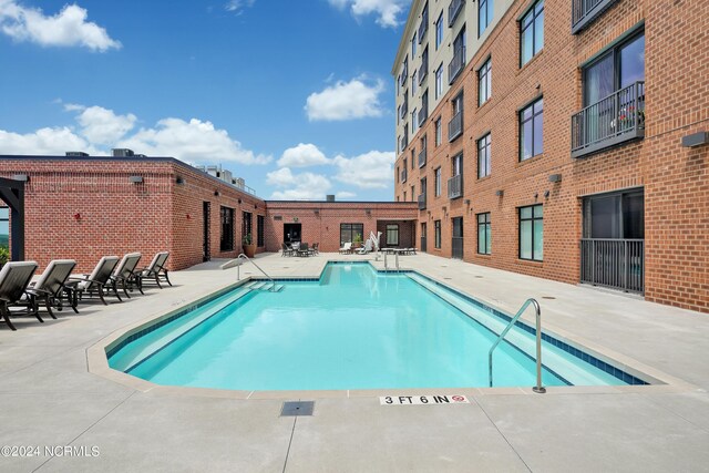 community pool with a patio