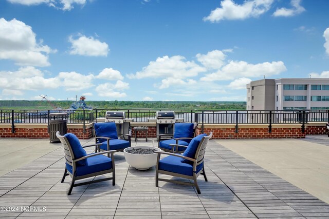 view of patio with an outdoor fire pit