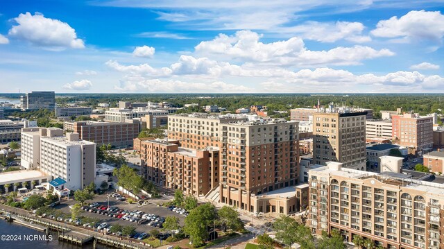 birds eye view of property featuring a view of city and a water view