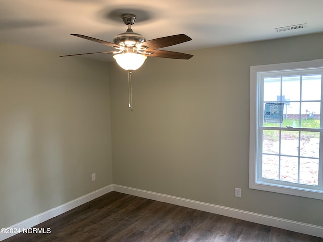 unfurnished room featuring dark hardwood / wood-style floors and ceiling fan