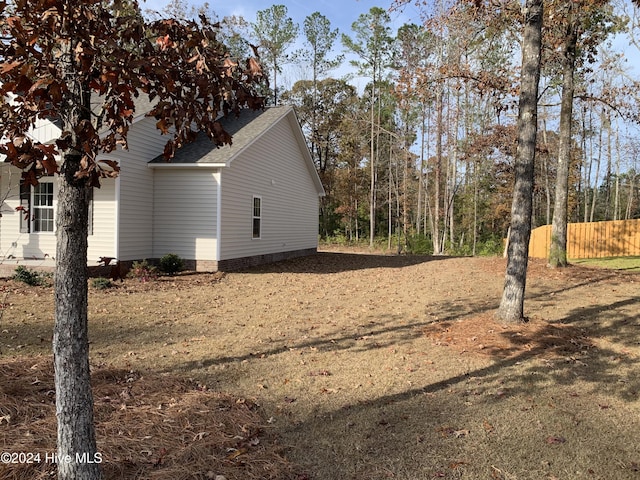 view of property exterior featuring a yard