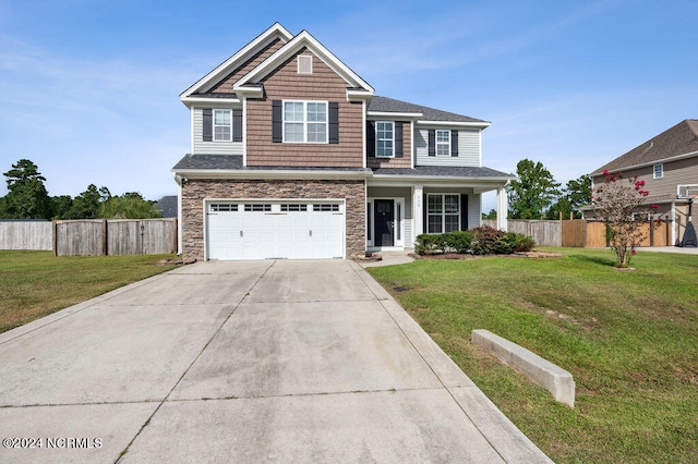 view of front facade with a front yard and a garage