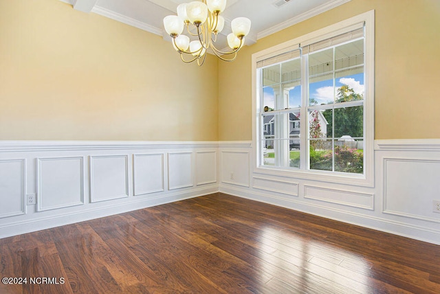 spare room with crown molding, a notable chandelier, and dark hardwood / wood-style flooring