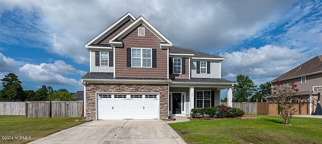 view of front of home featuring a garage, a front lawn, and a porch