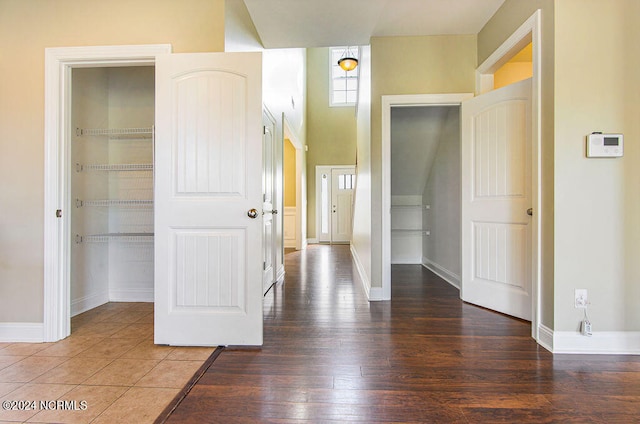 hallway with dark wood-type flooring