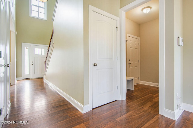 corridor with dark wood-type flooring