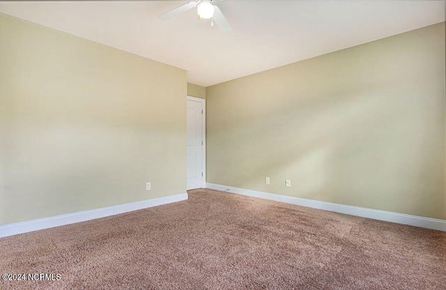 unfurnished room featuring carpet flooring