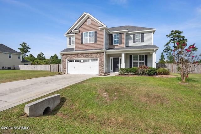 craftsman-style home with a front yard and a garage