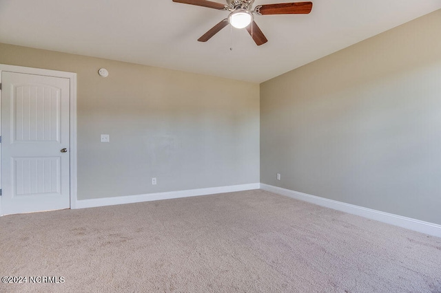 spare room with ceiling fan and carpet flooring