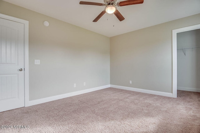 unfurnished bedroom featuring carpet floors and ceiling fan