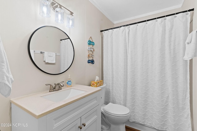 bathroom with walk in shower, vanity, crown molding, and toilet