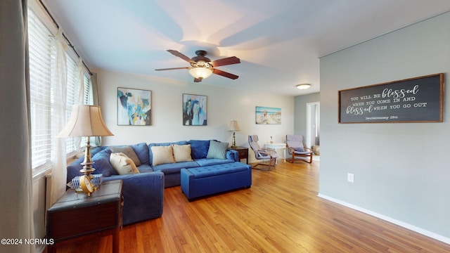 living room with ceiling fan, hardwood / wood-style floors, and a healthy amount of sunlight