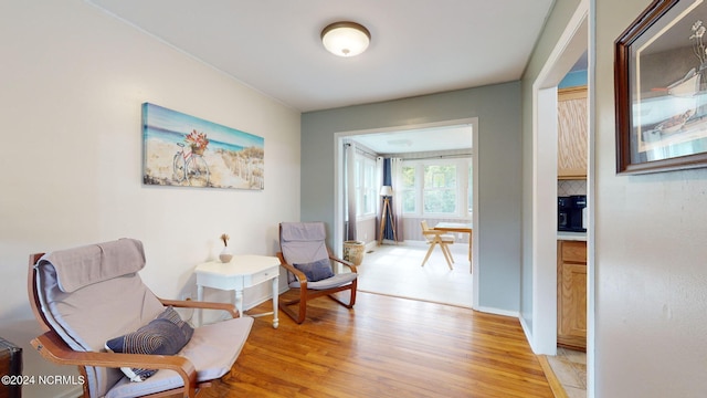 sitting room with light hardwood / wood-style flooring