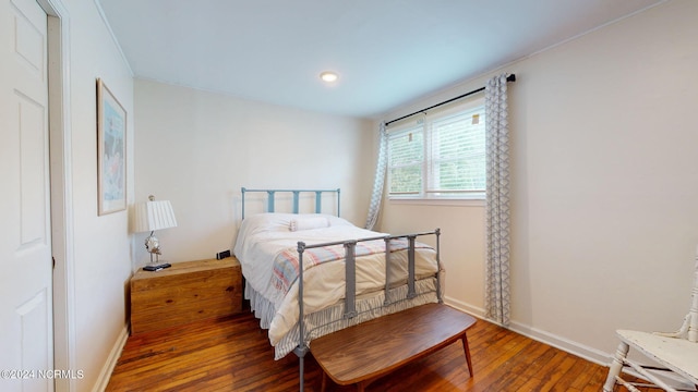 bedroom featuring dark hardwood / wood-style flooring