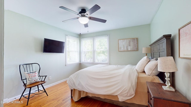 bedroom with light wood-type flooring and ceiling fan