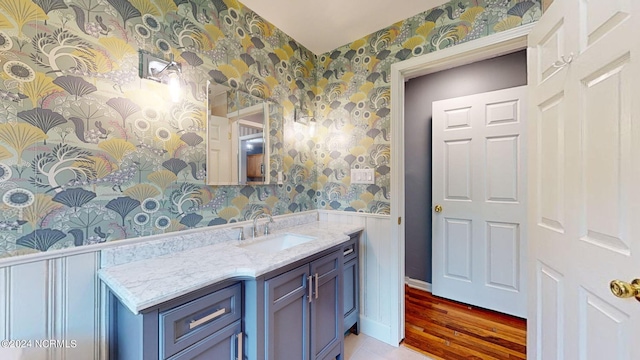 bathroom with hardwood / wood-style floors and vanity