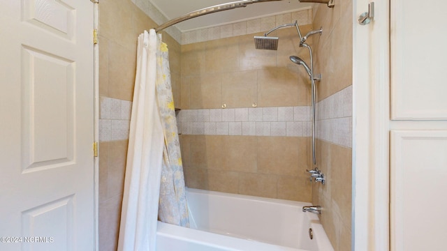 bathroom with shower / bath combo with shower curtain