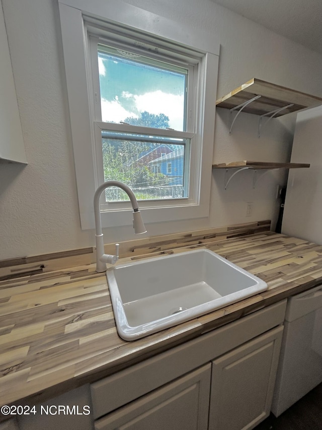 104 Charles St, Hertford, NC 27944 - kitchen with a sink, wooden counters, plenty of natural light, and open shelves