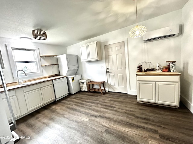 kitchen with stacked washing maching and dryer, dark wood finished floors, a sink, a wall mounted air conditioner, and dishwasher