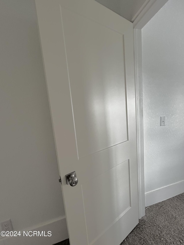 104 Charles St, Hertford, NC 27944 - detailed view of baseboards and carpet flooring