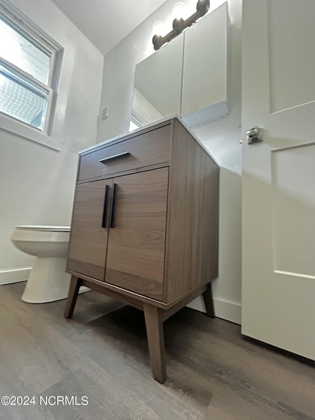 104 Charles St, Hertford, NC 27944 - bathroom featuring wood finished floors, baseboards, and toilet