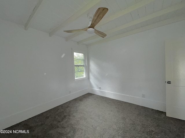 unfurnished room featuring beam ceiling, a ceiling fan, and baseboards