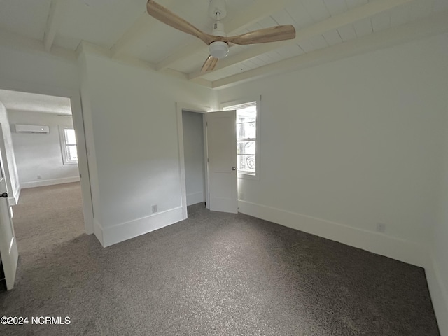 spare room with beamed ceiling, baseboards, and ceiling fan