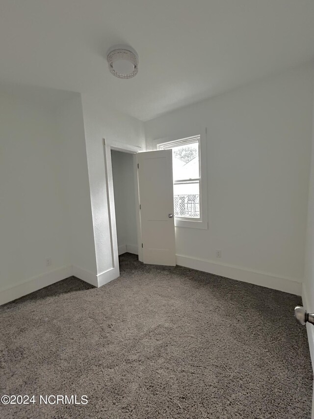 unfurnished bedroom with carpet