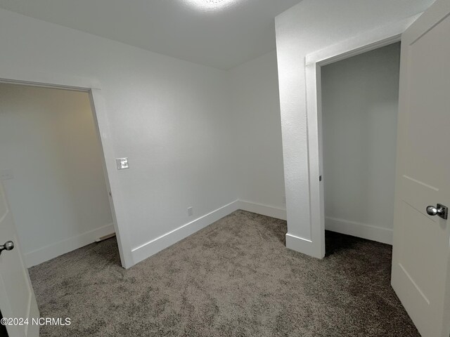 unfurnished bedroom featuring carpet flooring