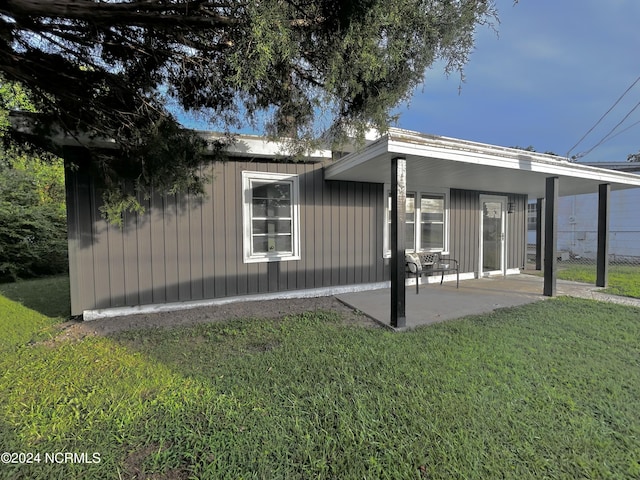 exterior space featuring a yard and a patio area