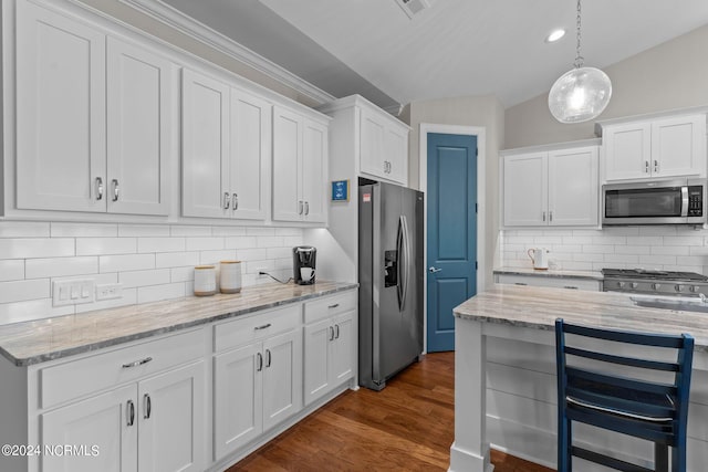 kitchen featuring dark wood-type flooring, stainless steel appliances, and white cabinets