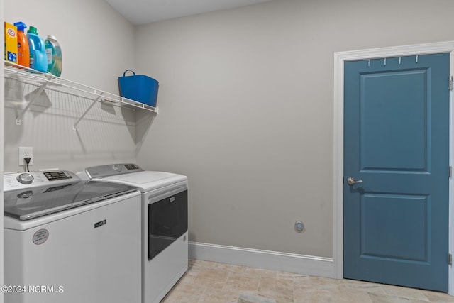 washroom with washer and dryer